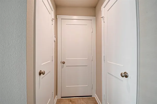 a bathroom with a glass shower door