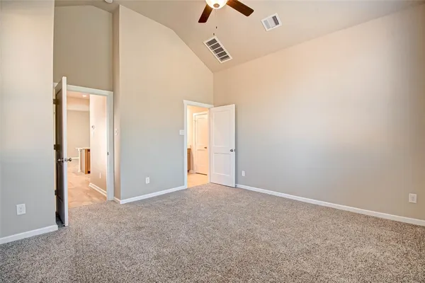 an empty room with projector and closet