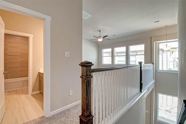 a view of a hallway with windows