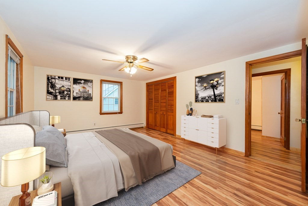 62 Spring Street Lexington, MA 02421 - Photo 22 of 32 a spacious bedroom with a bed and a view of bathroom