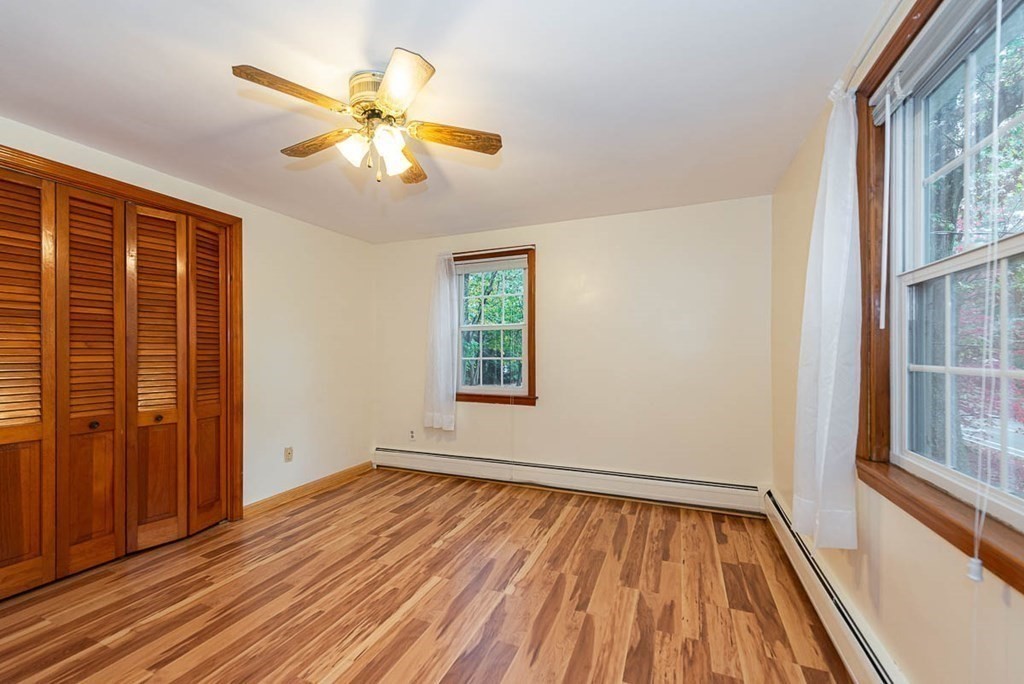 62 Spring Street Lexington, MA 02421 - Photo 27 of 32 wooden floor in an empty room with a window