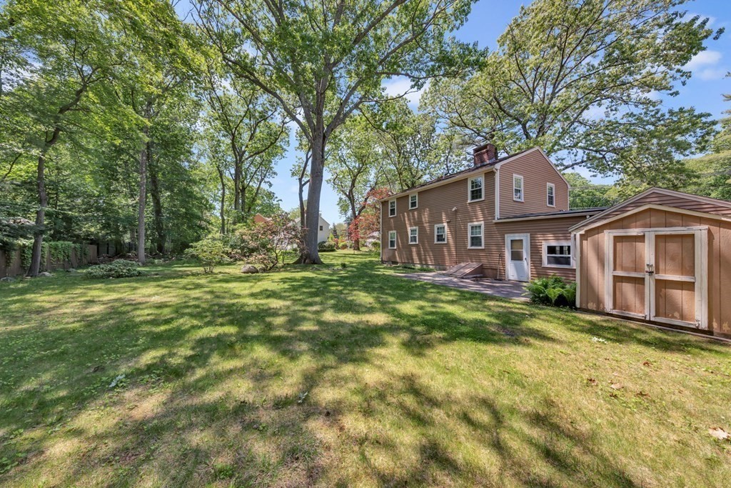 62 Spring Street Lexington, MA 02421 - Photo 31 of 32 a front view of a house with a yard