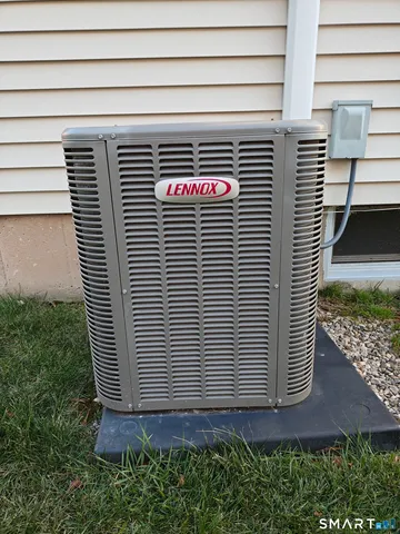 a front view of a house with plants