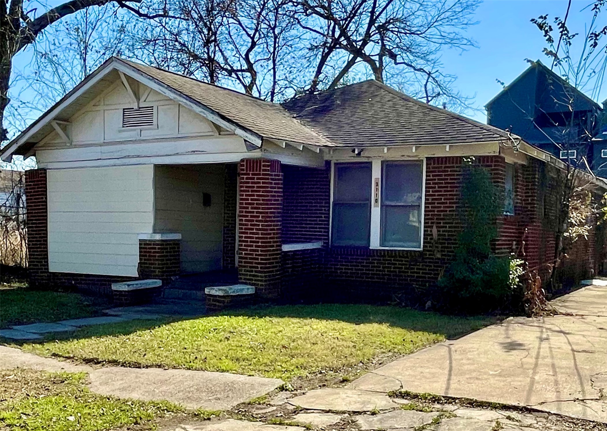 3110 Gray Street Houston, TX 77004 - Photo 3 of 14 a front view of a house with garden