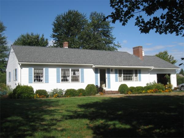 233 South Meadow Road Lancaster, MA 01523 - Photo 1 of 21 a front view of a house with a garden