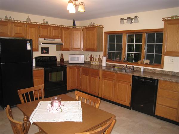 233 South Meadow Road Lancaster, MA 01523 - Photo 2 of 21 a kitchen with granite countertop a sink stainless steel appliances and cabinets