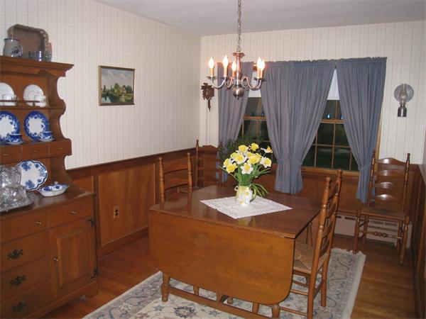 233 South Meadow Road Lancaster, MA 01523 - Photo 3 of 21 a view of a dining room with furniture and chandelier