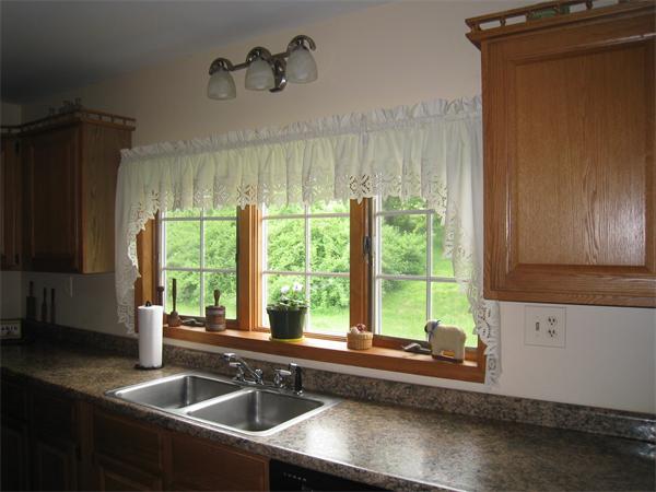 233 South Meadow Road Lancaster, MA 01523 - Photo 4 of 21 a kitchen with a sink and a large window