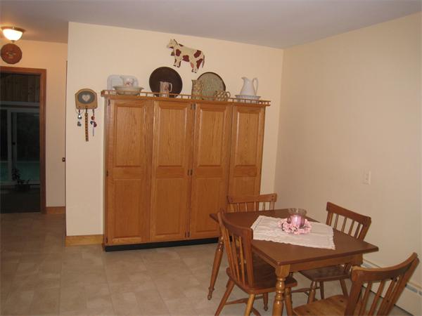 233 South Meadow Road Lancaster, MA 01523 - Photo 8 of 21 a view of a room with furniture and wooden closet