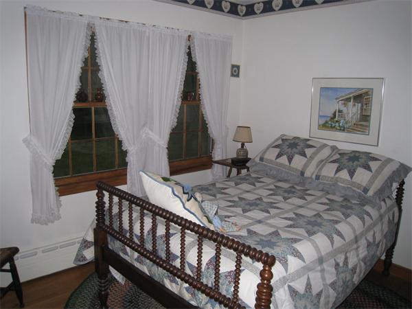 233 South Meadow Road Lancaster, MA 01523 - Photo 10 of 21 a bed sitting in a bedroom next to a window