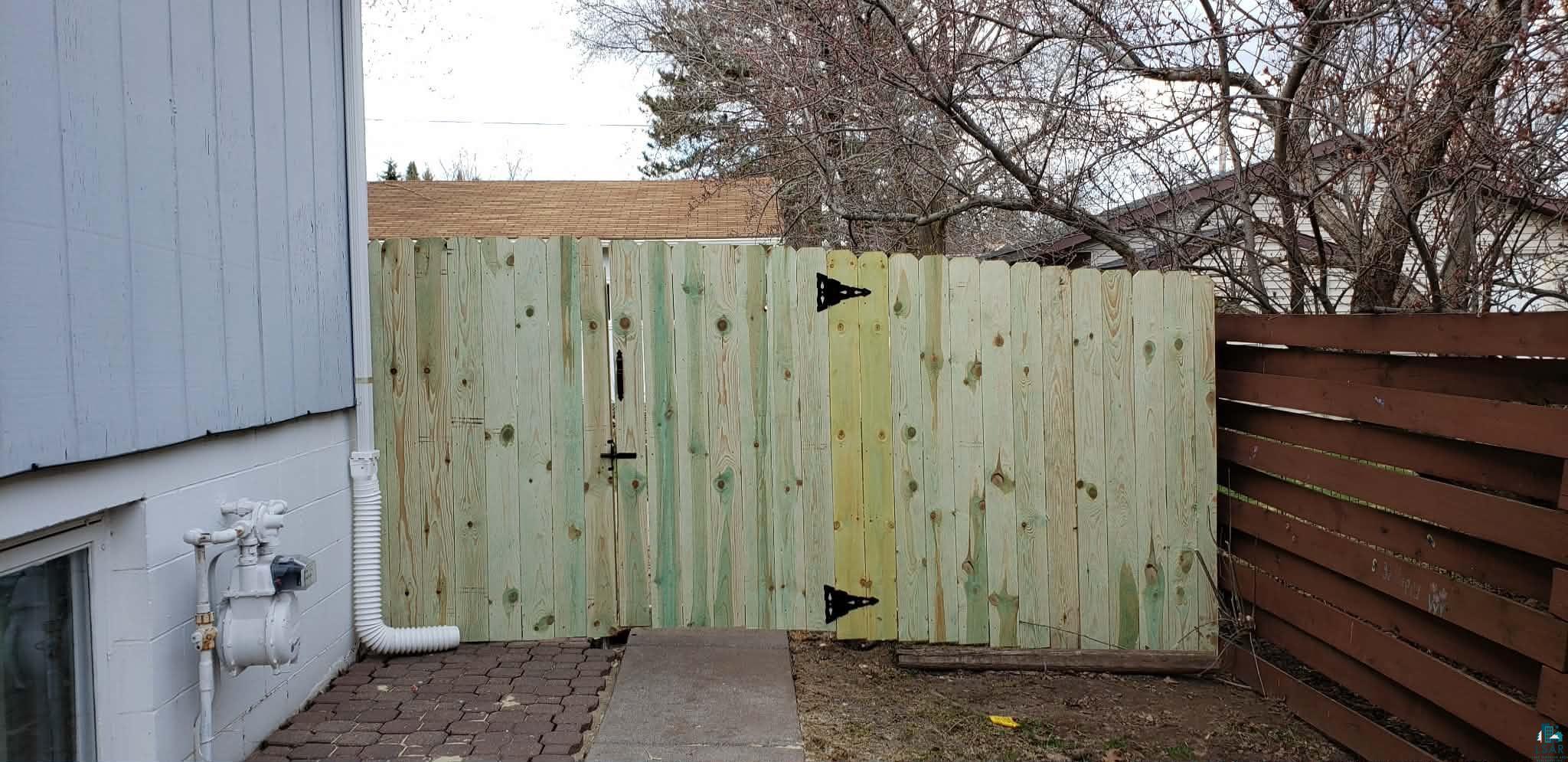 9237 Orchard Street Duluth, MN 55810 - Photo 40 of 44 spring/summer photo when fence was added