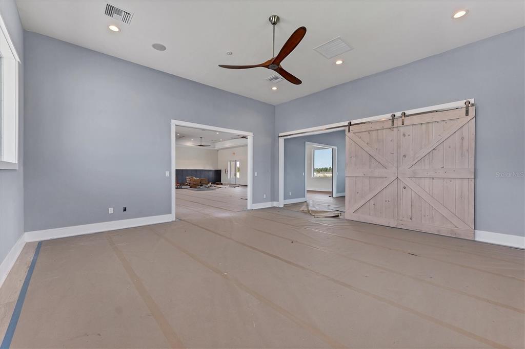9001 Gasparilla Road, Unit 6 Rotonda West, FL 33947 - Photo 35 of 79 an empty room with a ceiling fan and window