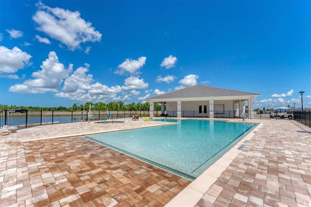 9001 Gasparilla Road, Unit 6 Rotonda West, FL 33947 - Photo 52 of 79 a view of a house with swimming pool