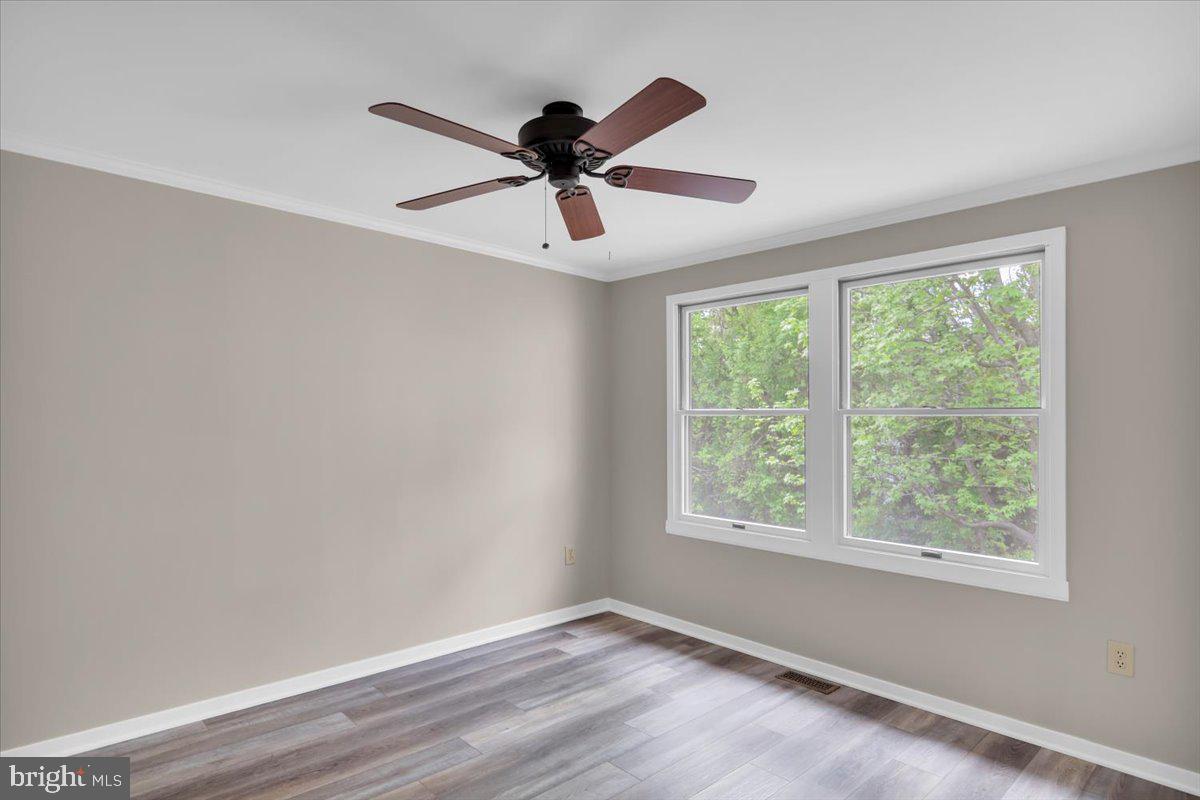518 Demoss Court Glassboro, NJ 08028 - Photo 14 of 29 a view of an empty room with wooden floor and a window