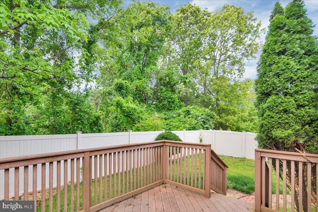 a view of a balcony with wooden floor