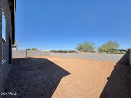 a view of a swimming pool and an outdoor space