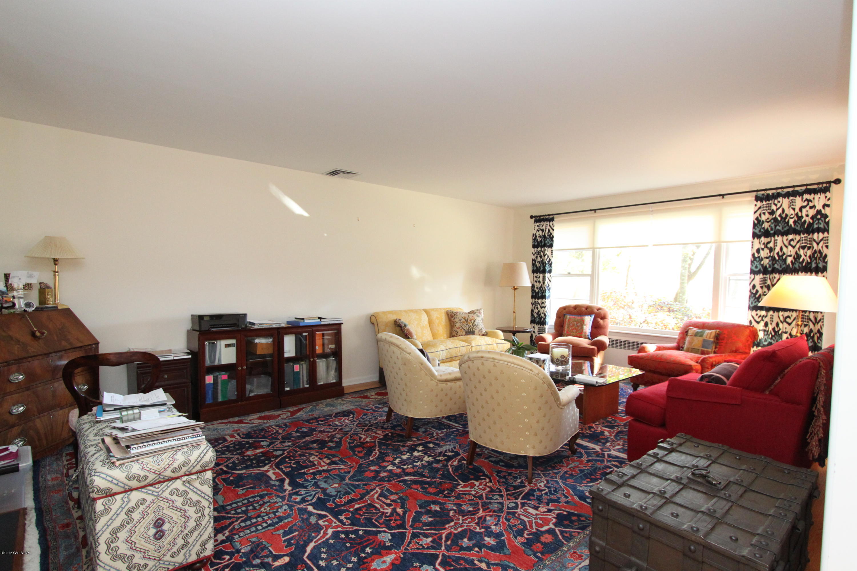 26 Beechcroft Road Greenwich, CT 06830 - Photo 2 of 6 a living room with furniture a rug and a large window