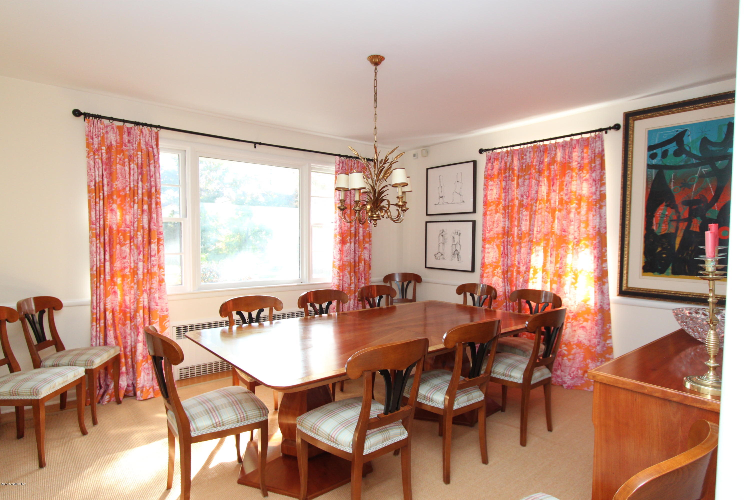 26 Beechcroft Road Greenwich, CT 06830 - Photo 3 of 6 a view of a dining room with furniture window and outside view