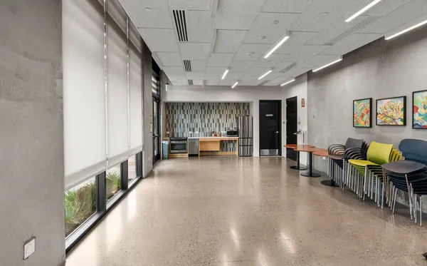 a dining room with furniture and a chandelier