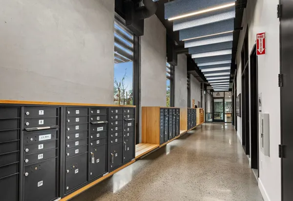 a view of a hallway with windows