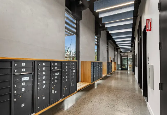 a view of a hallway with windows