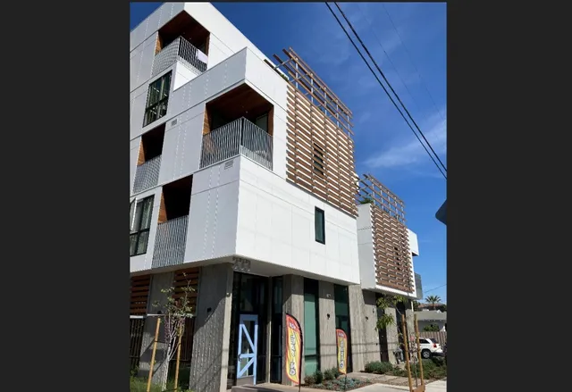 a front view of a building with glass windows