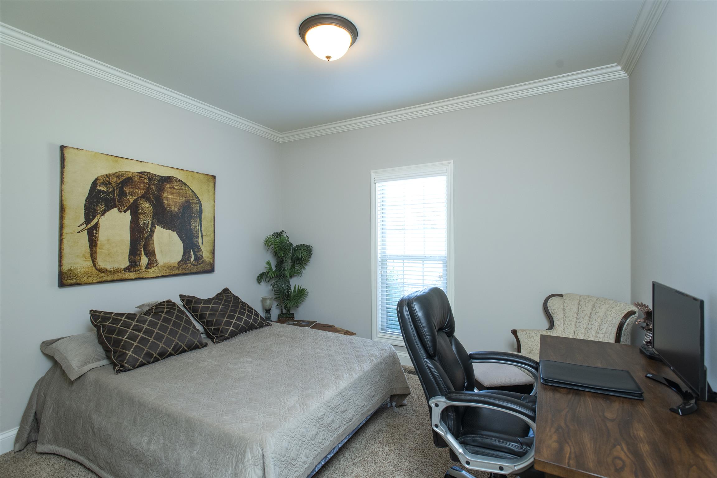580 Academy Road Lebanon, TN 37087 - Photo 15 of 30 a bedroom with a bed and chair