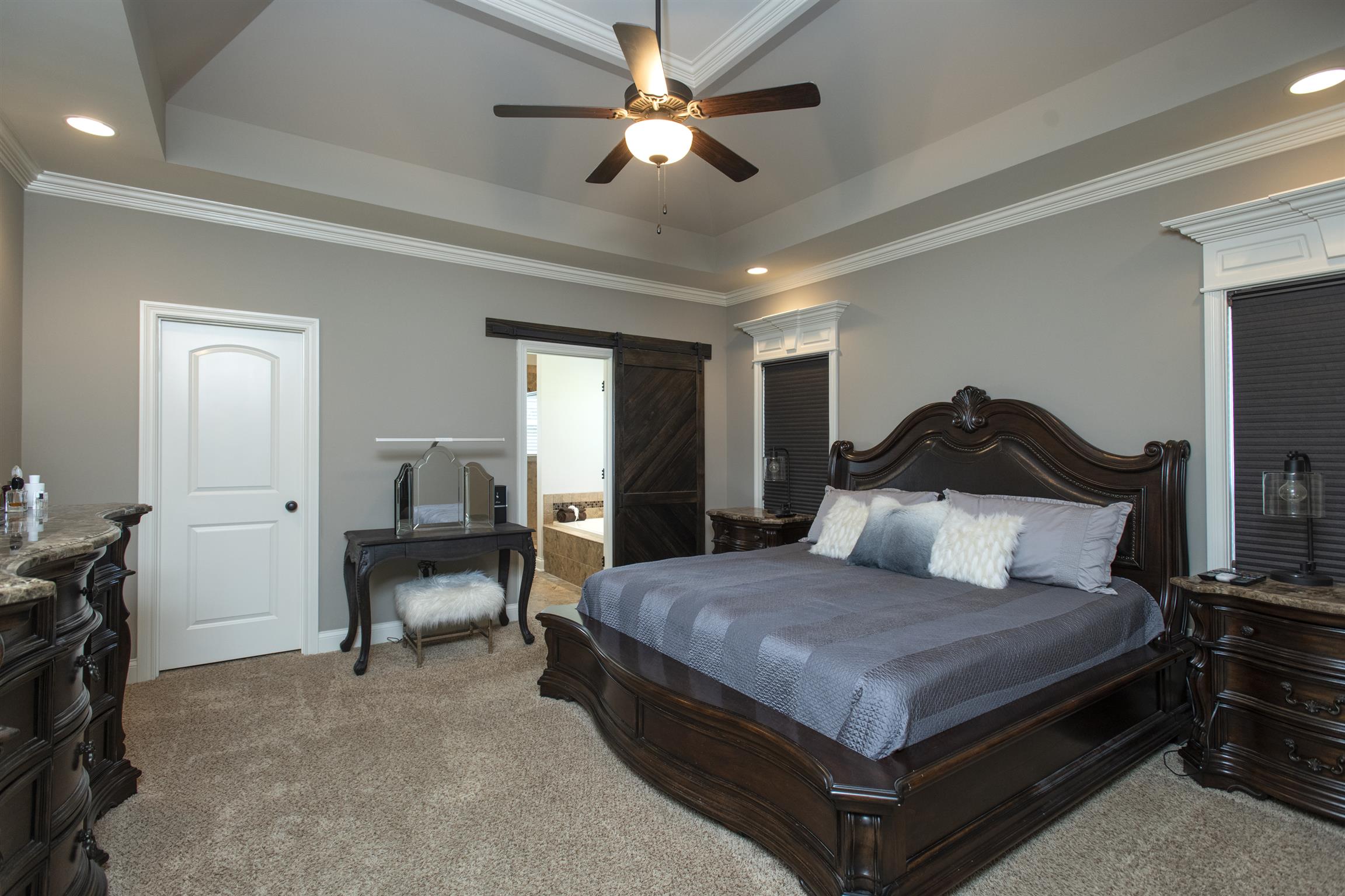 580 Academy Road Lebanon, TN 37087 - Photo 17 of 30 a bedroom with a bed and a chandelier