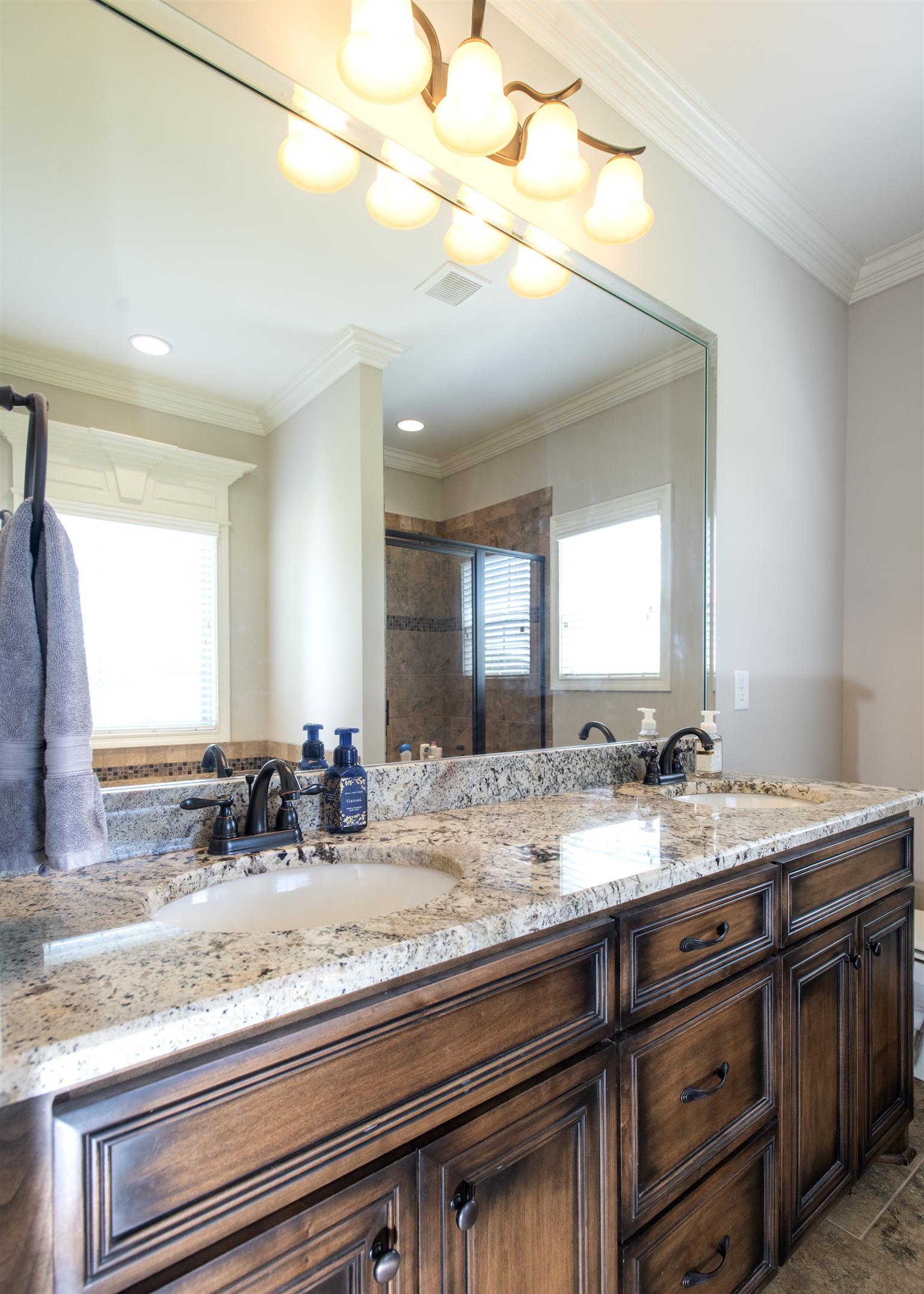 580 Academy Road Lebanon, TN 37087 - Photo 19 of 30 a bathroom with a granite countertop sink and a mirror