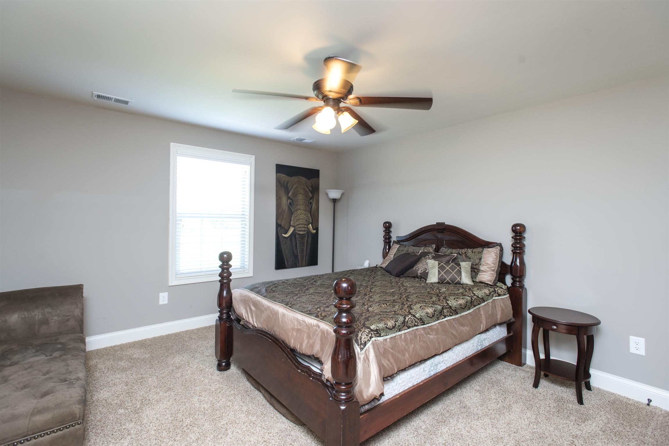 580 Academy Road Lebanon, TN 37087 - Photo 25 of 30 a bed sitting in a bedroom next to a window