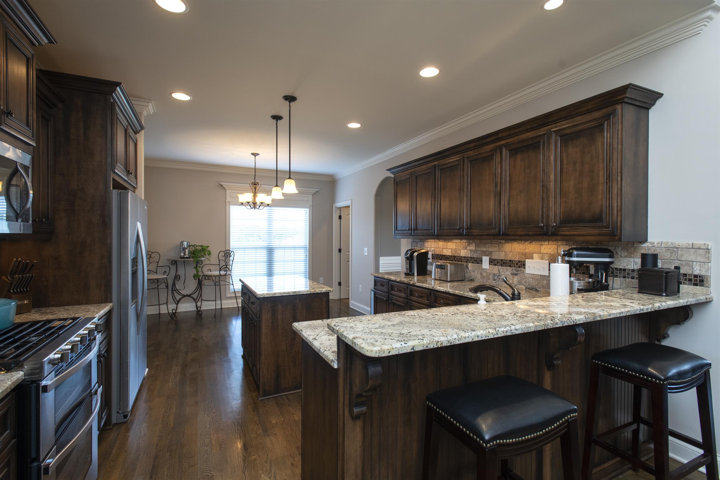 580 Academy Road Lebanon, TN 37087 - Photo 9 of 30 a kitchen with granite countertop a sink appliances and cabinets