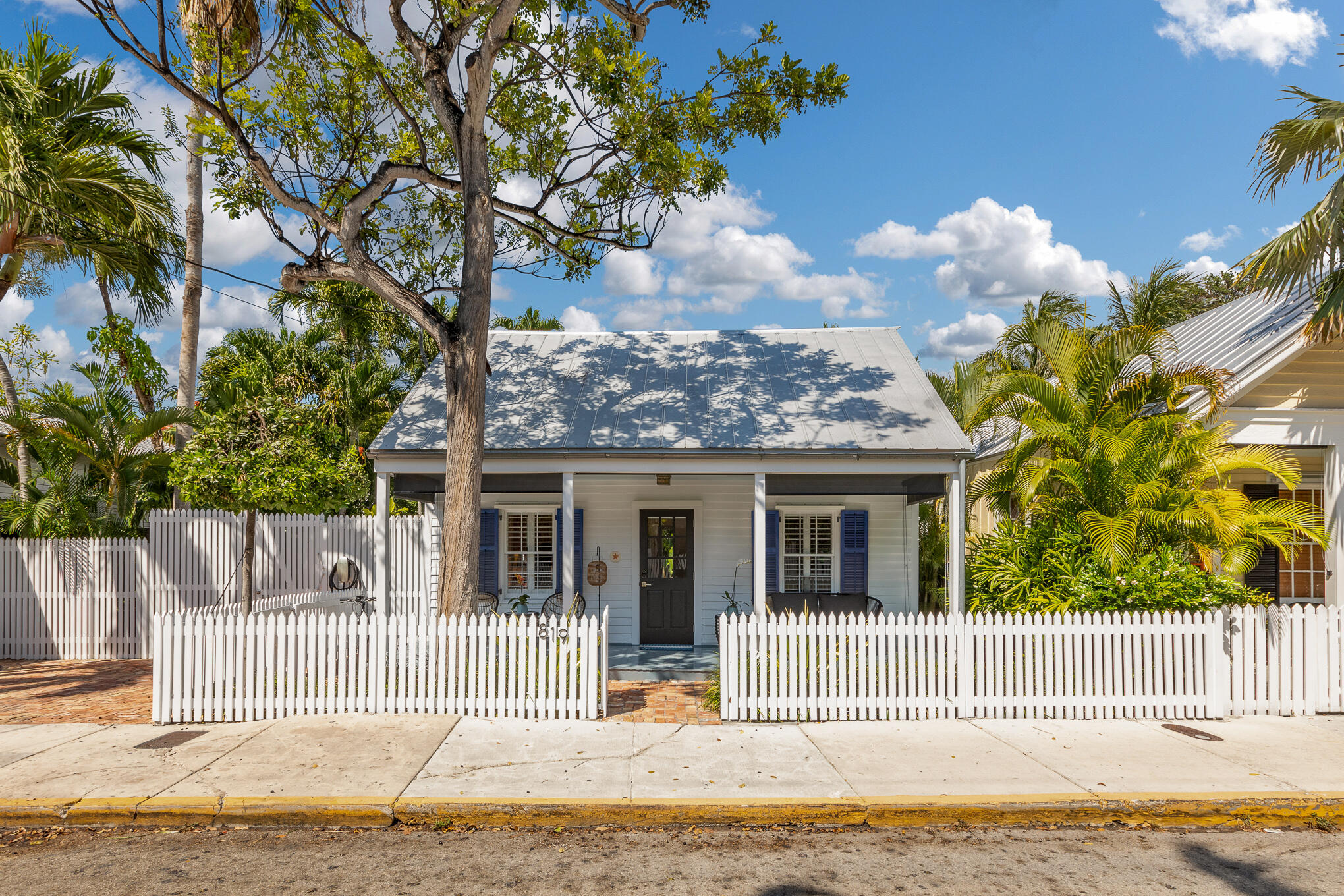 a view of a house with a garden and pathway