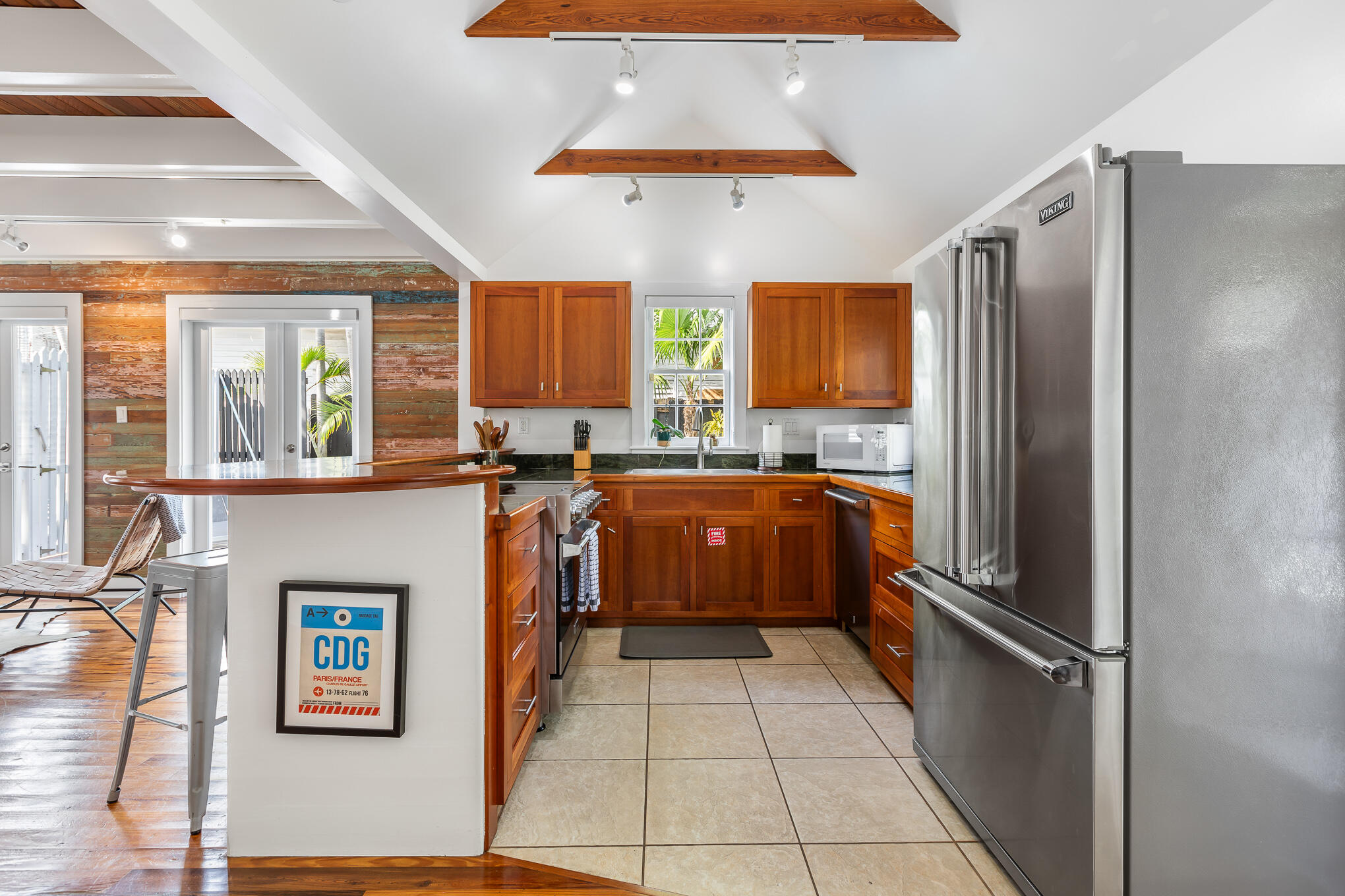 819 Elizabeth Street Key West, FL 33040 - Photo 11 of 28 a kitchen with stainless steel appliances granite countertop a refrigerator and a stove