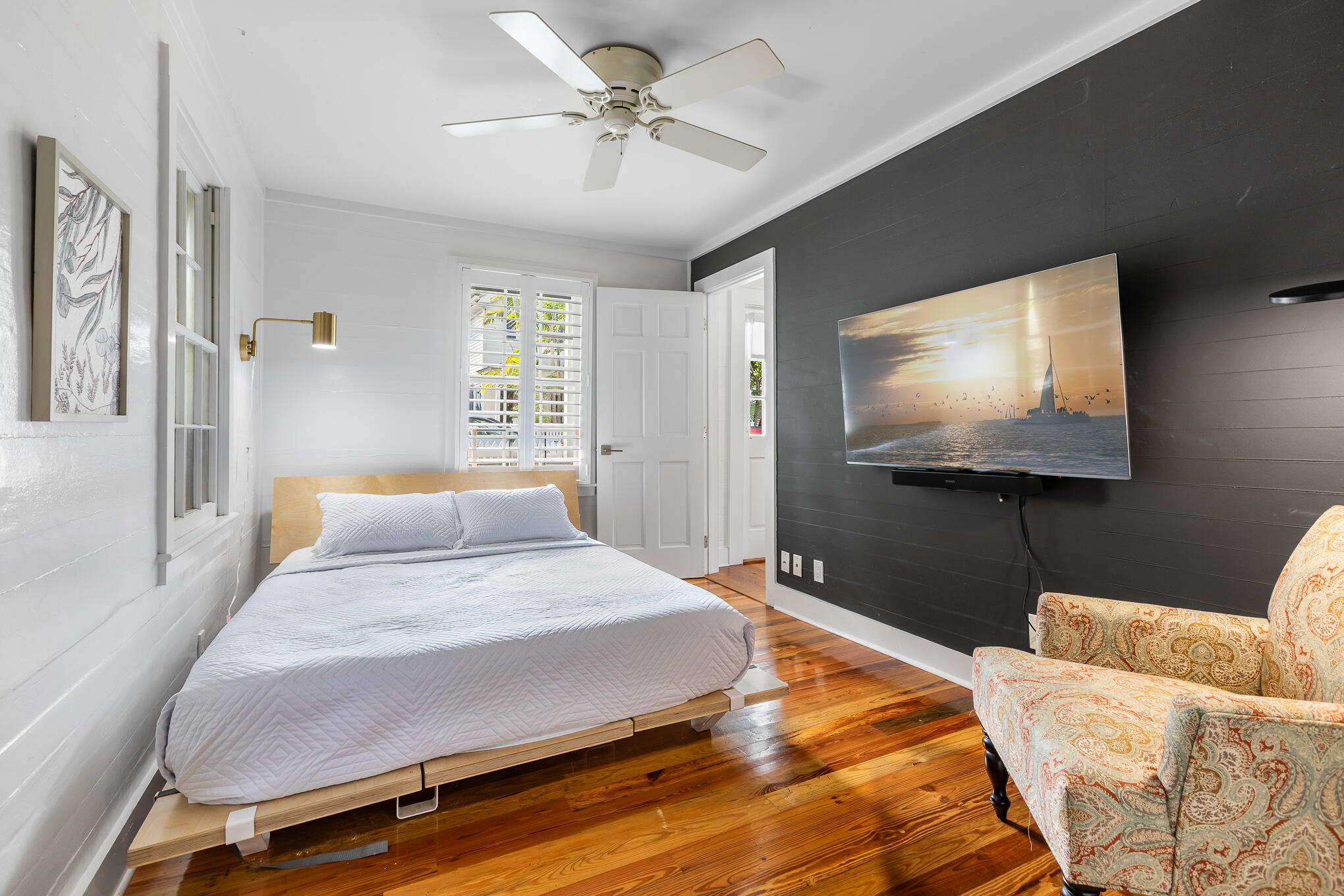 819 Elizabeth Street Key West, FL 33040 - Photo 14 of 28 a bedroom with a bed and a flat screen tv