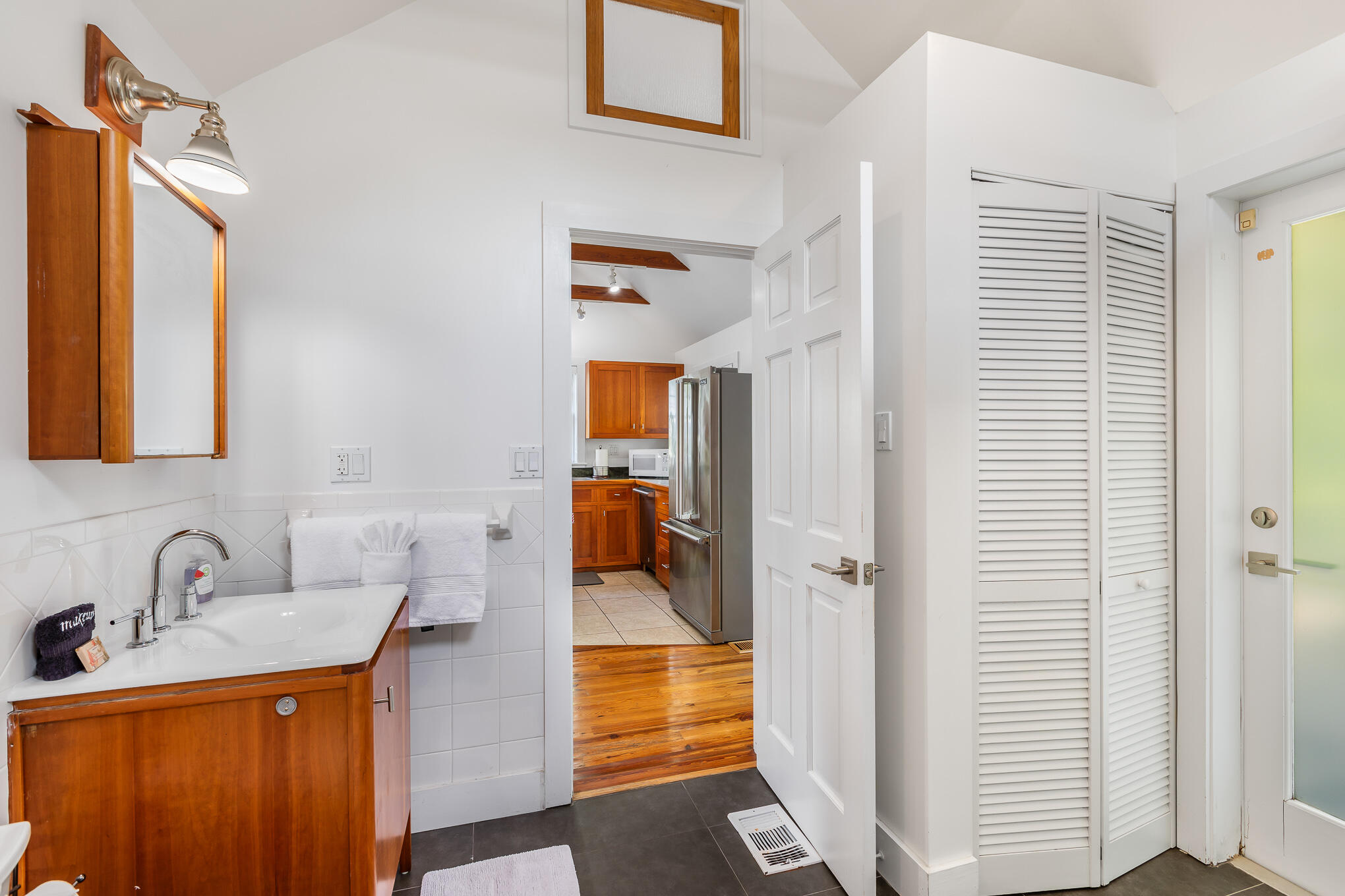 819 Elizabeth Street Key West, FL 33040 - Photo 16 of 28 a bathroom with a sink a mirror and shower