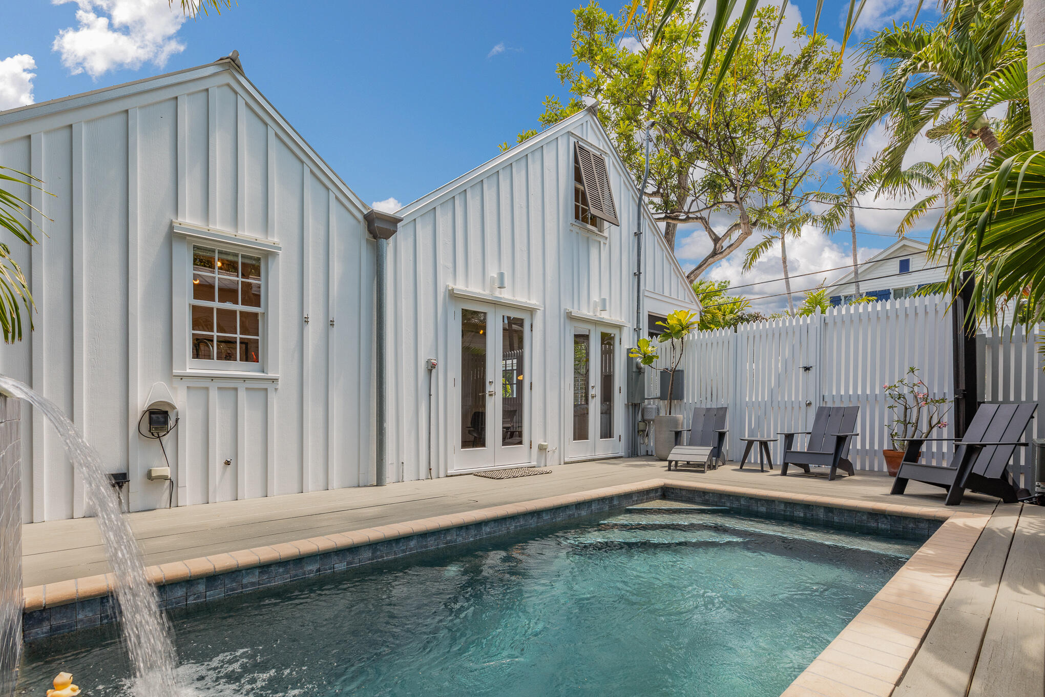 819 Elizabeth Street Key West, FL 33040 - Photo 24 of 28 a view of a house with swimming pool and sitting area