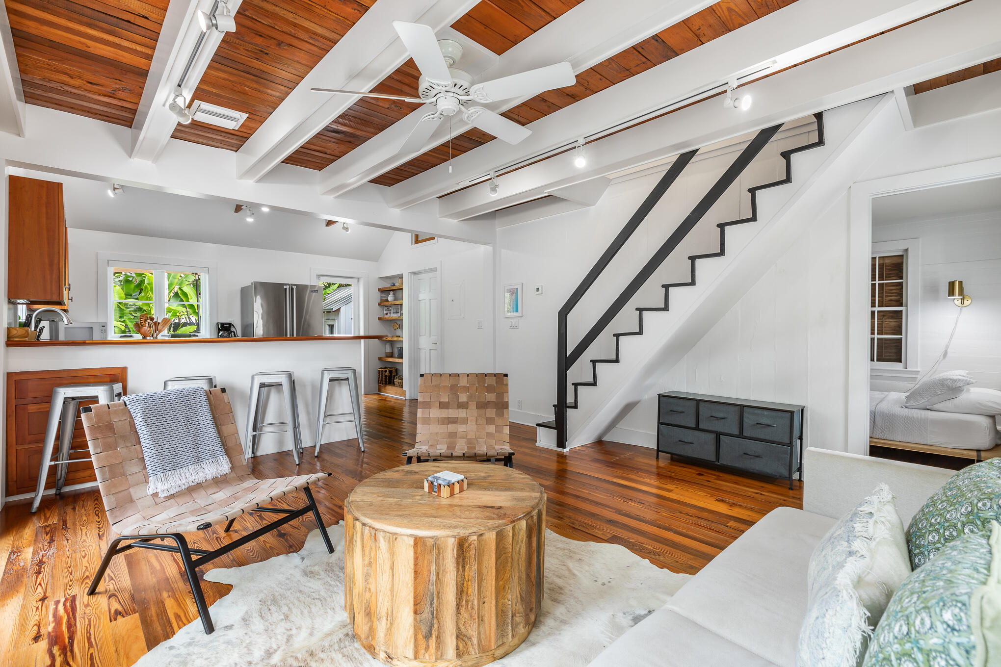 819 Elizabeth Street Key West, FL 33040 - Photo 6 of 28 a living room with furniture and a dining table with wooden floor