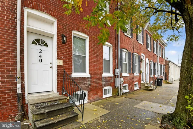 a view of a brick building with many windows