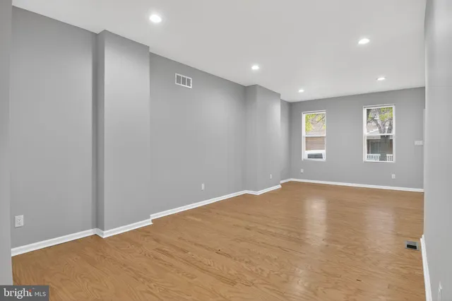 a view of an empty room with windows