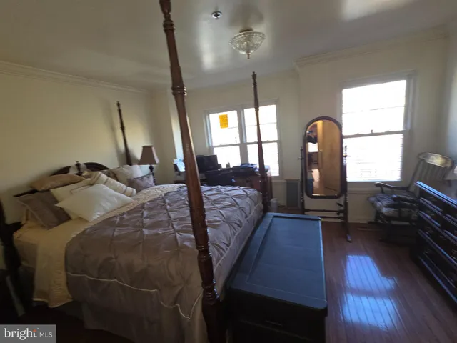 a bed room with bed and a window