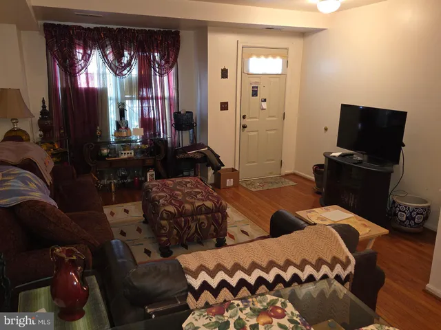 a bedroom with two beds and a television