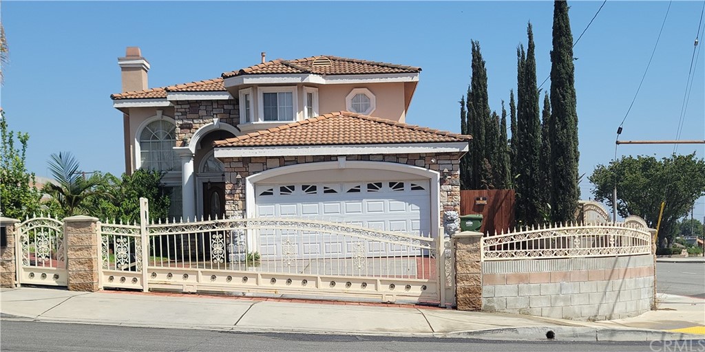 a front view of a house with a fence
