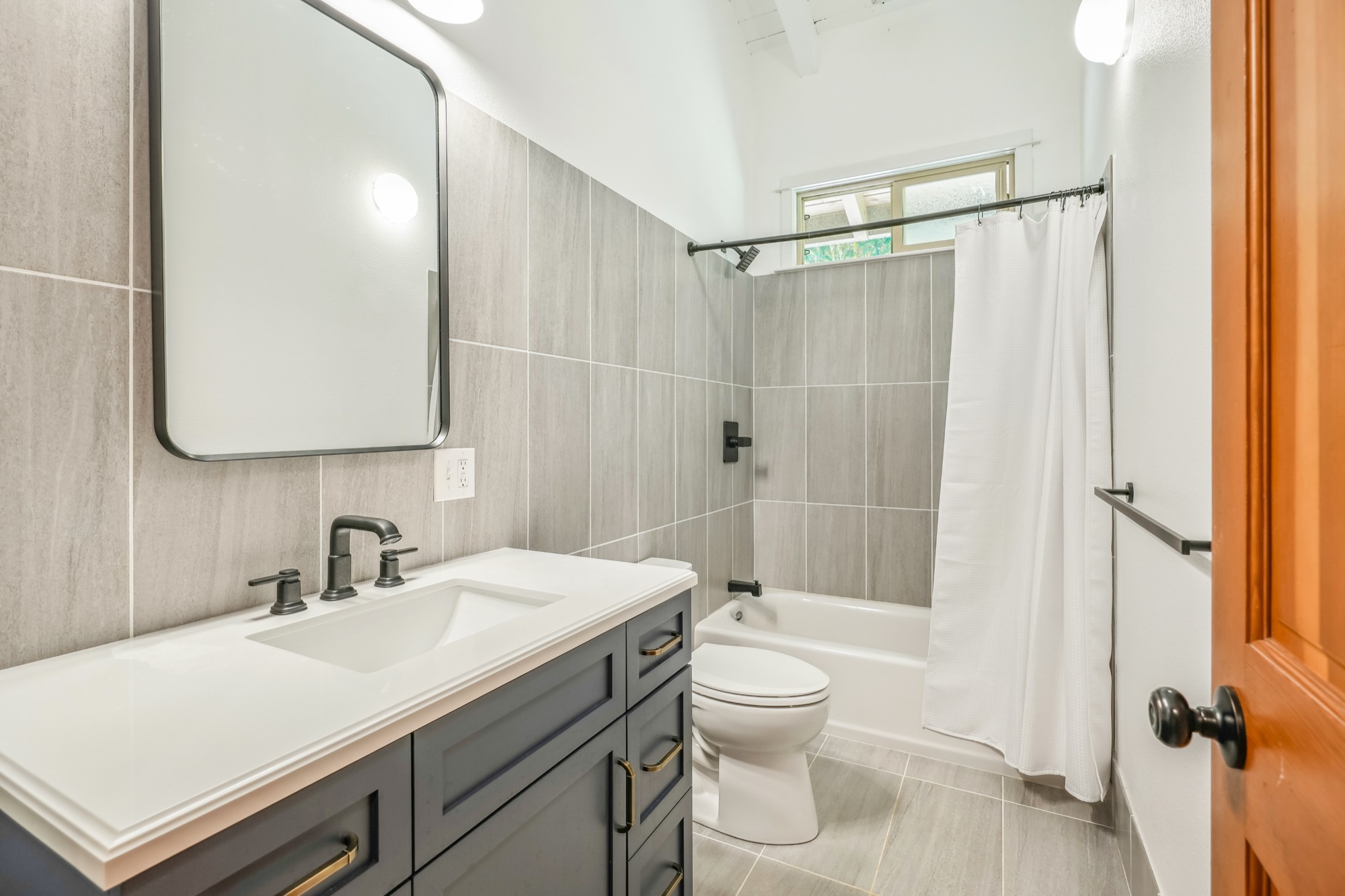 4631 Kahiliholo Road Kilauea, HI 96754 - Photo 11 of 11 a bathroom with a sink toilet vanity and shower