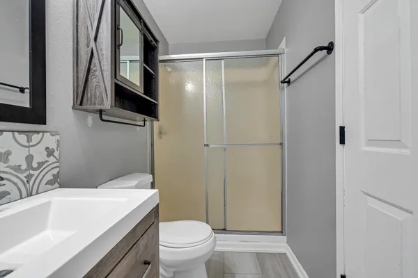 a bathroom with a sink a toilet and a bathtub