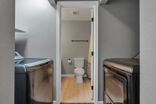 a view of bathroom with a toilet and a sink