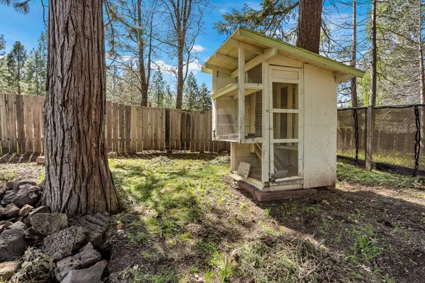 a view of a house with a yard and garage