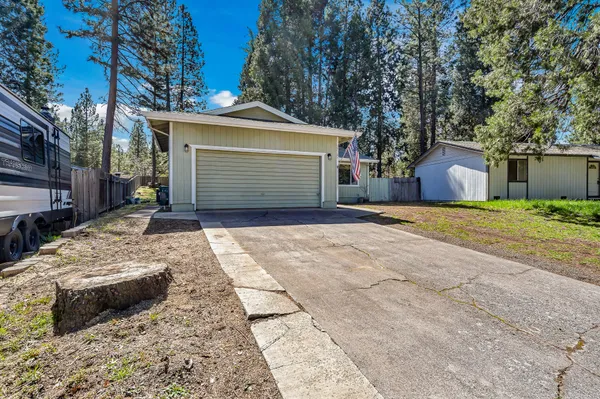 an aerial view of a house with outdoor space