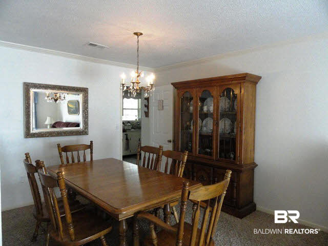622 Spanish Main Spanish Fort, AL 36527 - Photo 4 of 25 Formal Dining with Original Antique Chandelier and Room for Full Size China Cabinet
