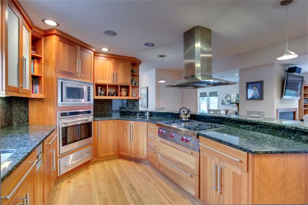 4 Longfellow Road Marblehead, MA 01945 - Photo 5 of 12 a kitchen with stainless steel appliances granite countertop a stove a sink and a refrigerator