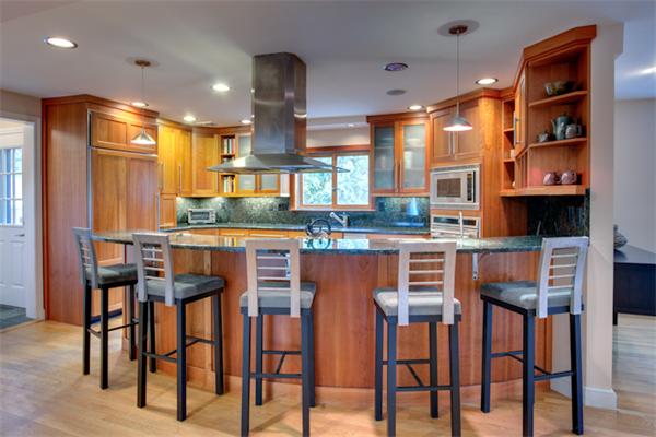 4 Longfellow Road Marblehead, MA 01945 - Photo 6 of 12 a kitchen with stainless steel appliances kitchen island granite countertop a table and chairs